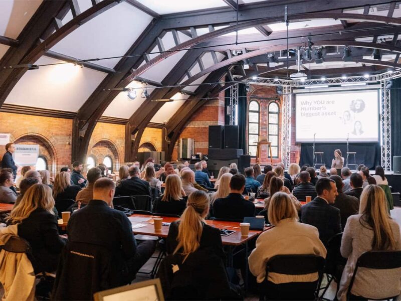 A photograph of a group of people at a corporate event in music venue Docks Academy, located in Grimsby.